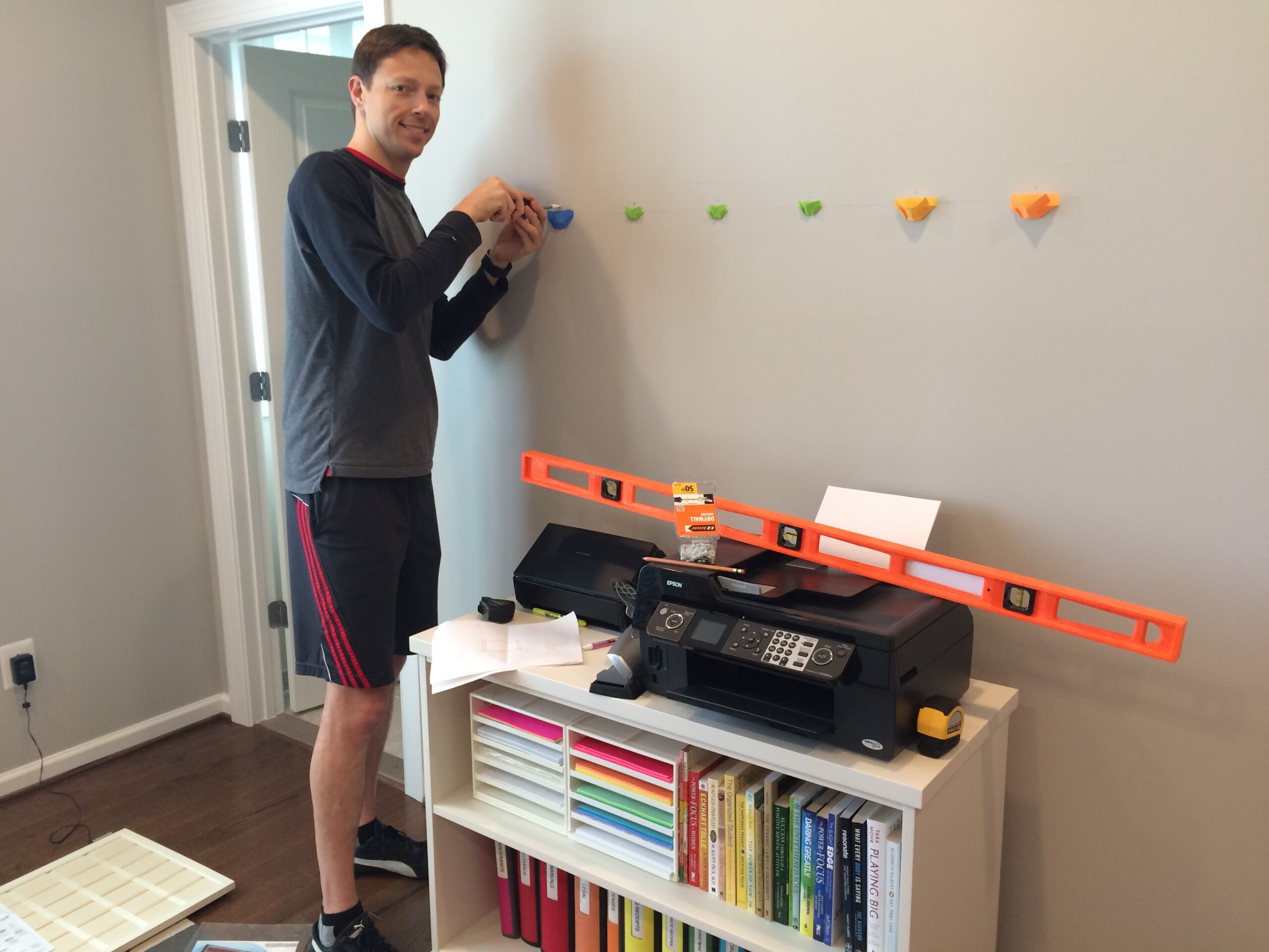 Ed hanging stuff on the walls!